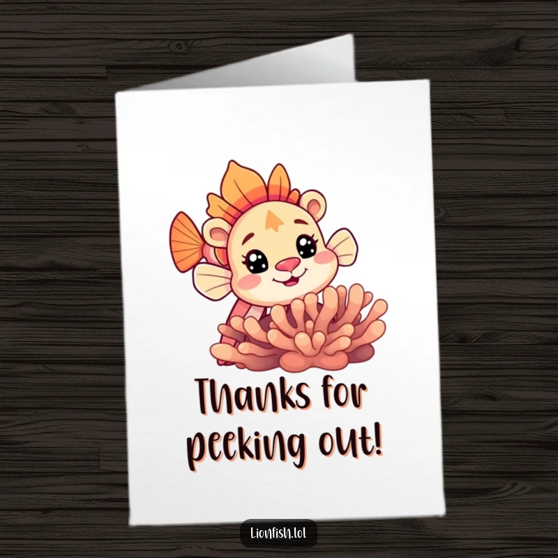 Funny Free Printable Thank You Card: A cute lionfish curiously peeking from behind coral, expressing thanks with a smile.